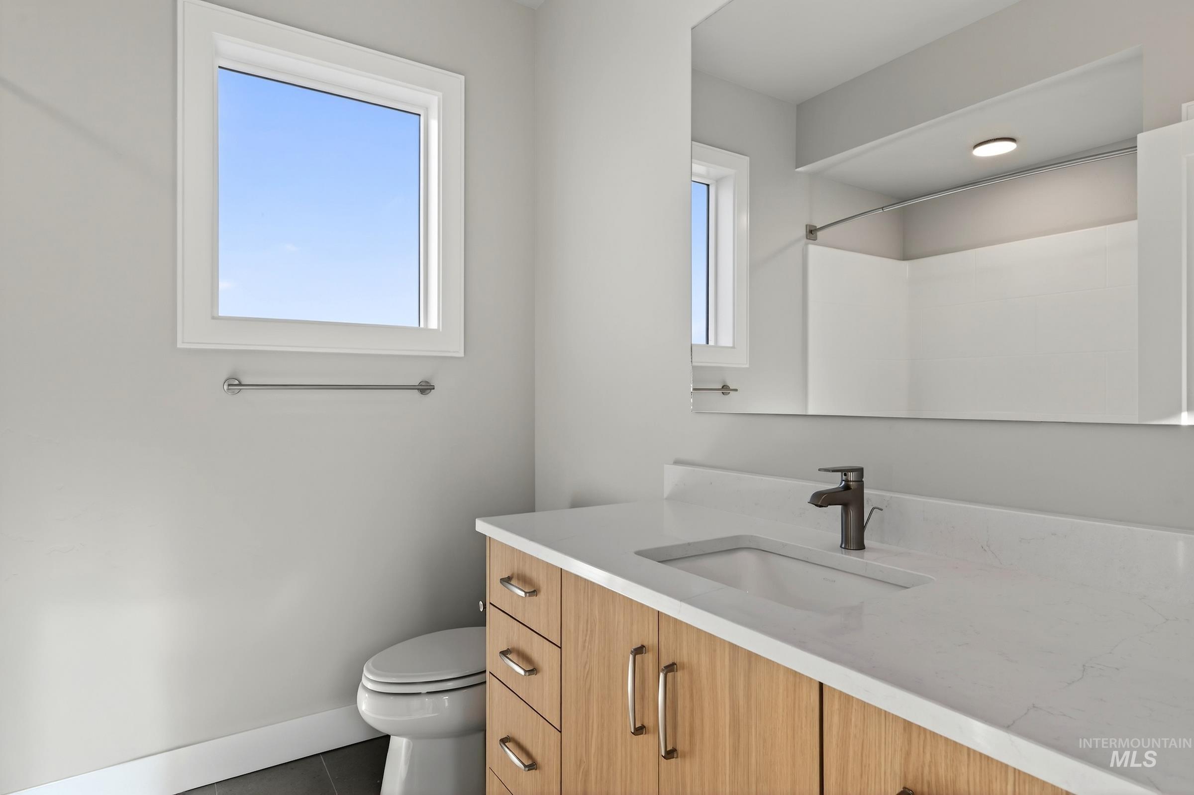 3374 West Neville Rnch Drive Boise, ID 83714 - Photo 31 of 37 Full bathroom featuring vanity, tile patterned flooring, and a shower
