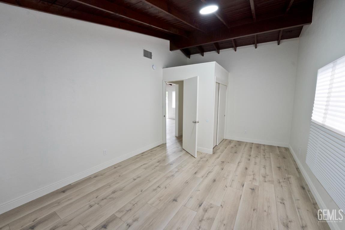 Undisclosed Address Wasco, CA 93280 - Photo 5 of 12 a view of a room with wooden floor and window