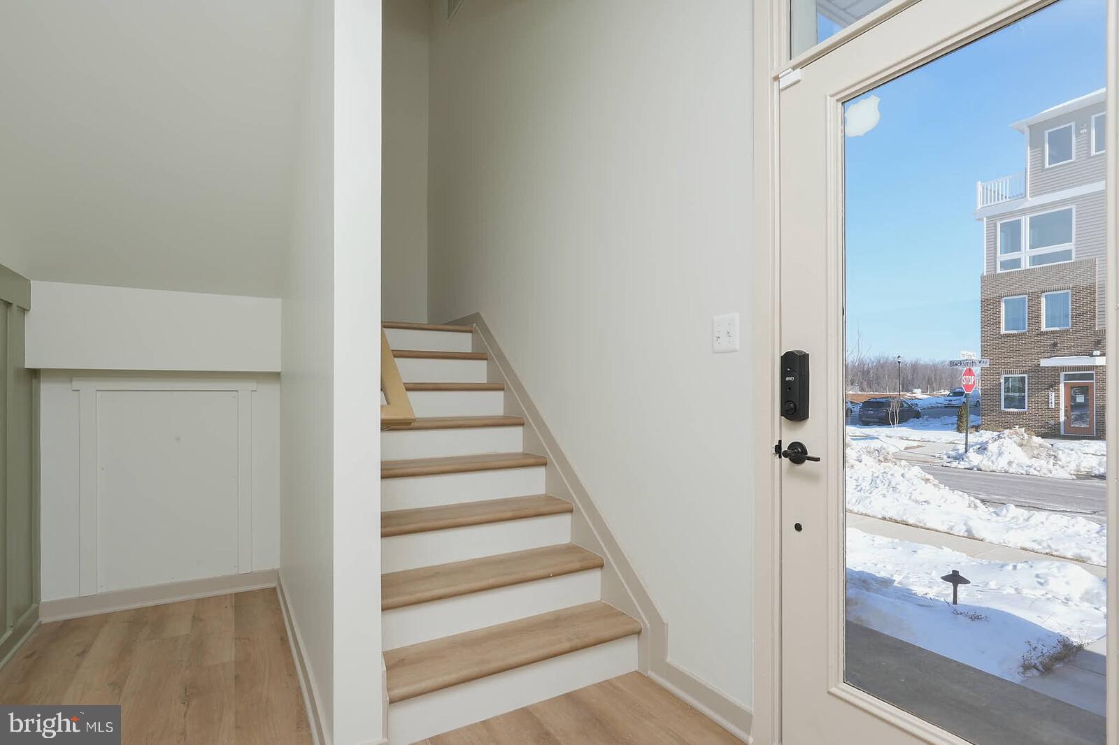 710 D Iron Frg Road Frederick, MD 21702 - Photo 11 of 43 a view of a hallway with wooden floor and entryway
