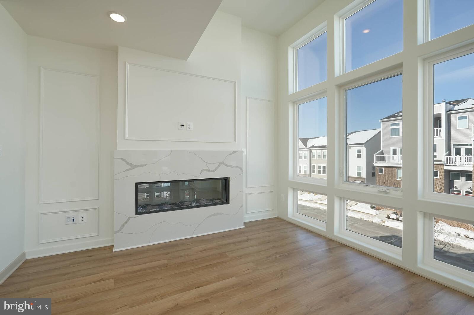 710 D Iron Frg Road Frederick, MD 21702 - Photo 17 of 43 a view of a livingroom with wooden floor and a fireplace