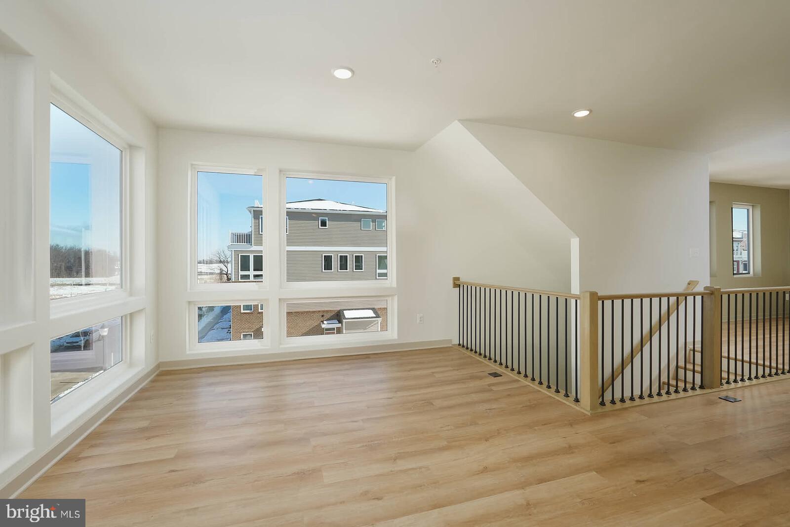 710 D Iron Frg Road Frederick, MD 21702 - Photo 18 of 43 a big room with wooden floor and windows