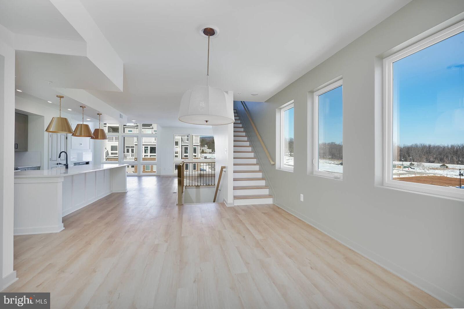 710 D Iron Frg Road Frederick, MD 21702 - Photo 20 of 43 a view of a living room with hardwood floor and a window