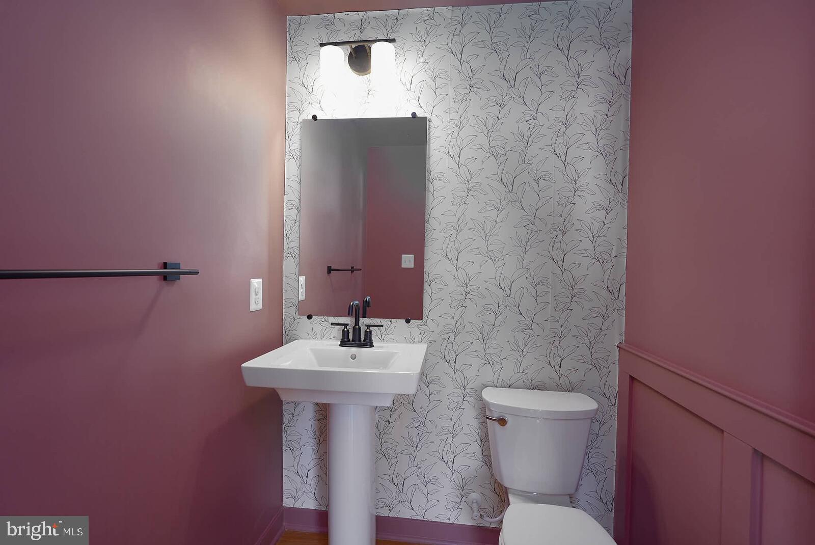 710 D Iron Frg Road Frederick, MD 21702 - Photo 21 of 43 a bathroom with a toilet sink and mirror