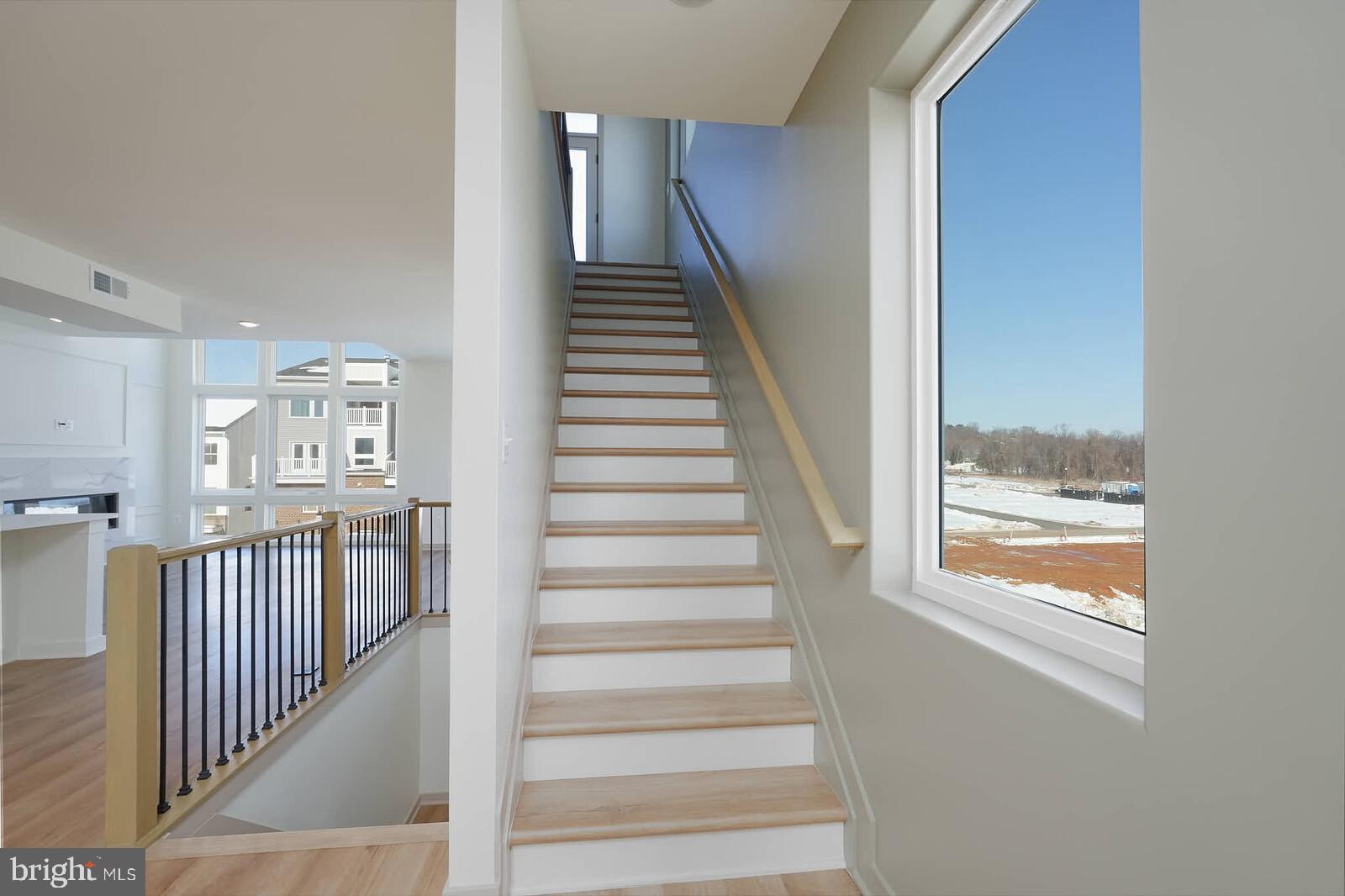 710 D Iron Frg Road Frederick, MD 21702 - Photo 23 of 43 a view of entryway and hall with wooden floor