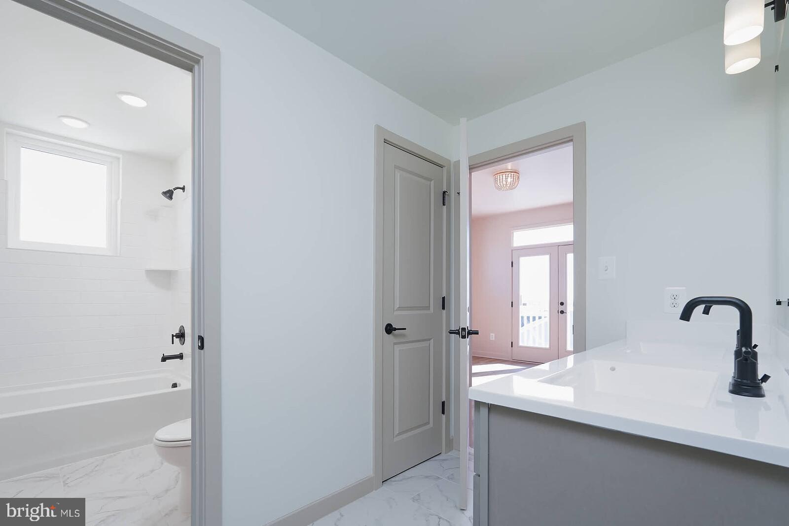710 D Iron Frg Road Frederick, MD 21702 - Photo 32 of 43 a bathroom with a sink a toilet and shower