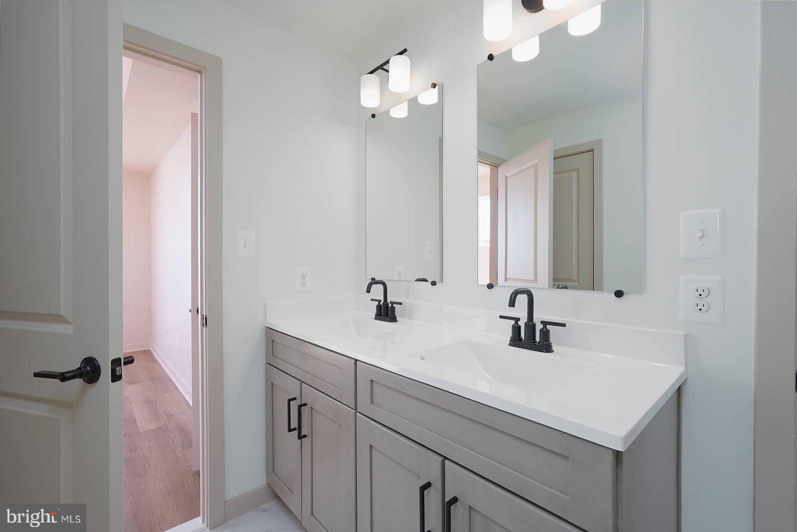710 D Iron Frg Road Frederick, MD 21702 - Photo 33 of 43 a bathroom with a sink and a mirror