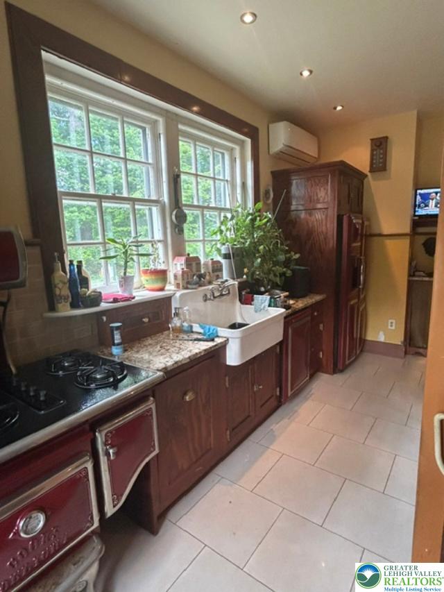 1170 Mosser Road Breinigsville, PA 18031 - Photo 10 of 19 A well-lit kitchen with generous window views of surrounding greenery.