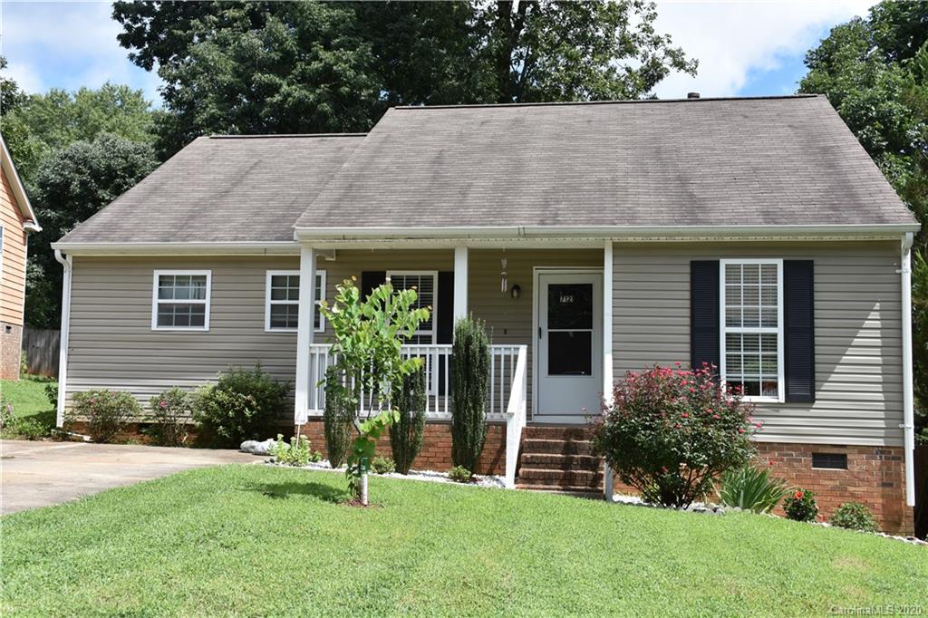 7121 Rena Mae Lane Charlotte, NC 28227 - Photo 1 of 21 a house that has a garden in front of it