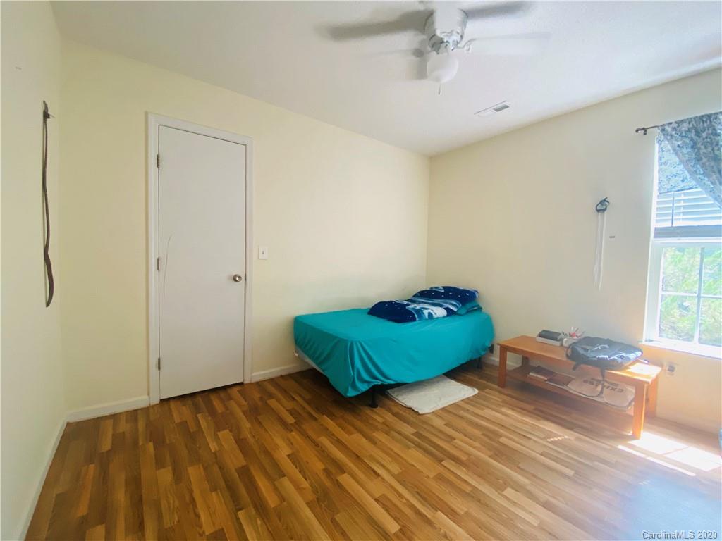 7121 Rena Mae Lane Charlotte, NC 28227 - Photo 13 of 21 a bedroom with a bed and a window