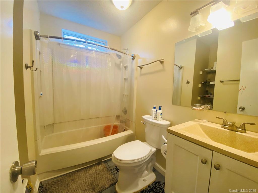7121 Rena Mae Lane Charlotte, NC 28227 - Photo 14 of 21 a bathroom with a sink toilet and shower