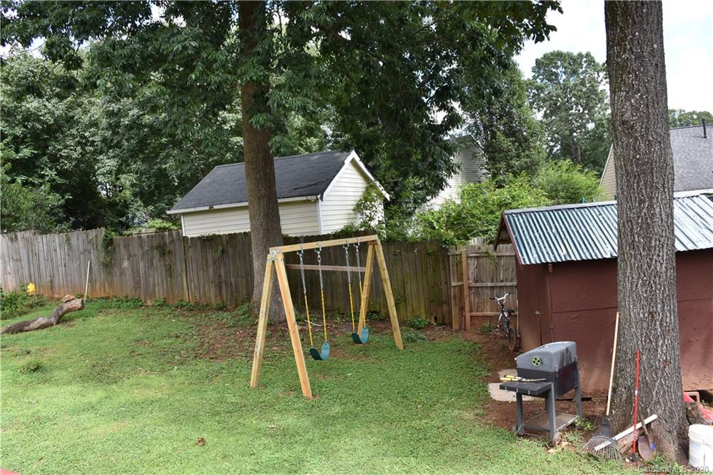 7121 Rena Mae Lane Charlotte, NC 28227 - Photo 20 of 21 a house view with a backyard space and a slide