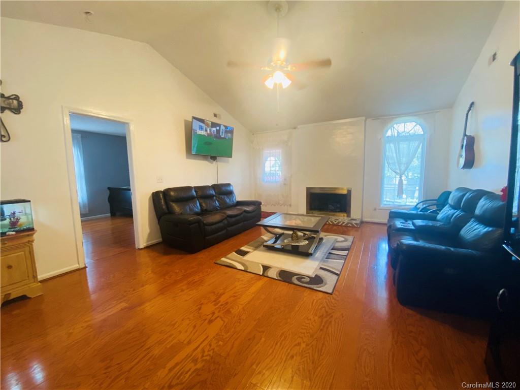 7121 Rena Mae Lane Charlotte, NC 28227 - Photo 8 of 21 a living room with furniture and a flat screen tv