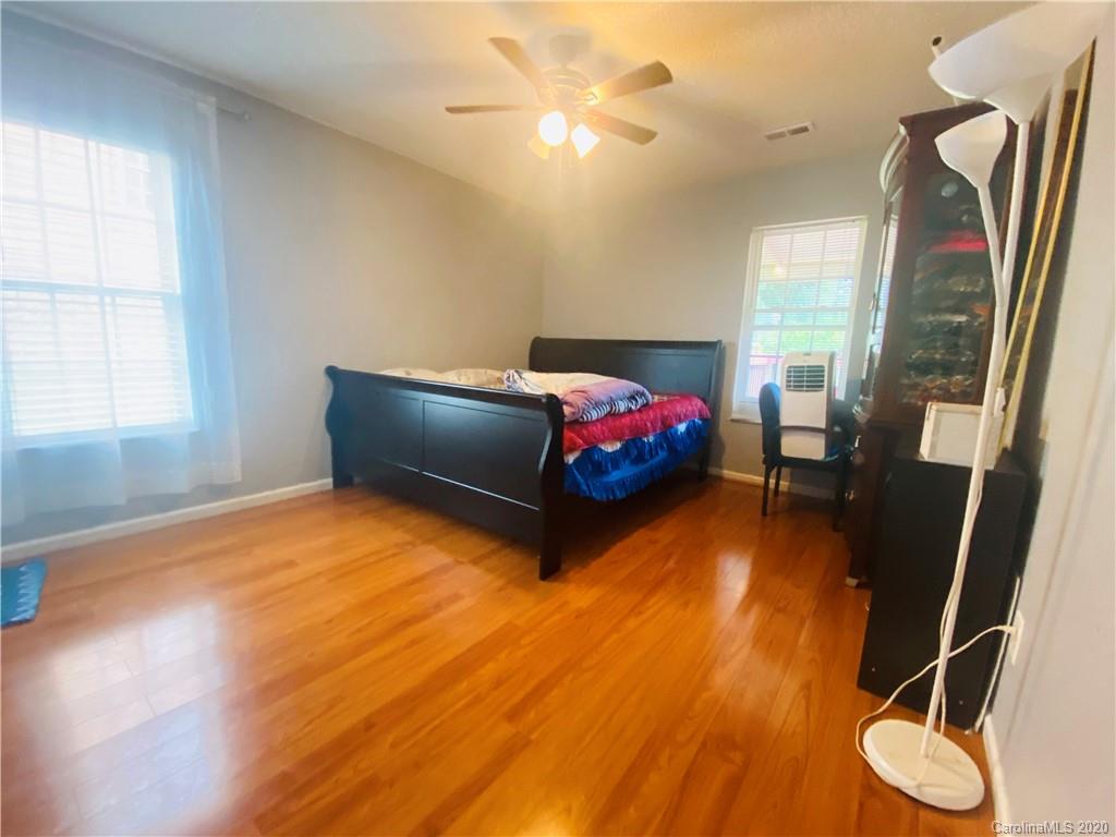 7121 Rena Mae Lane Charlotte, NC 28227 - Photo 9 of 21 a bedroom with a bed and a window