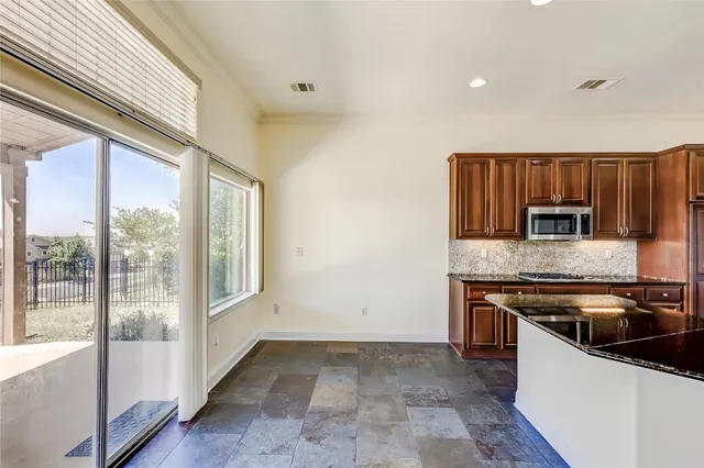 a kitchen with a stove and a sink