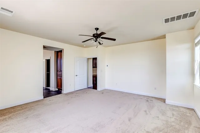 a view of empty room with windows