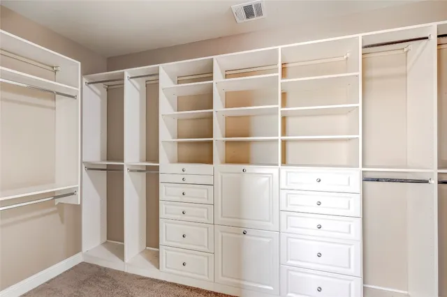 a bathroom with a bathtub and next to a window