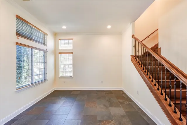 a view of entryway with stairs and wooden floor
