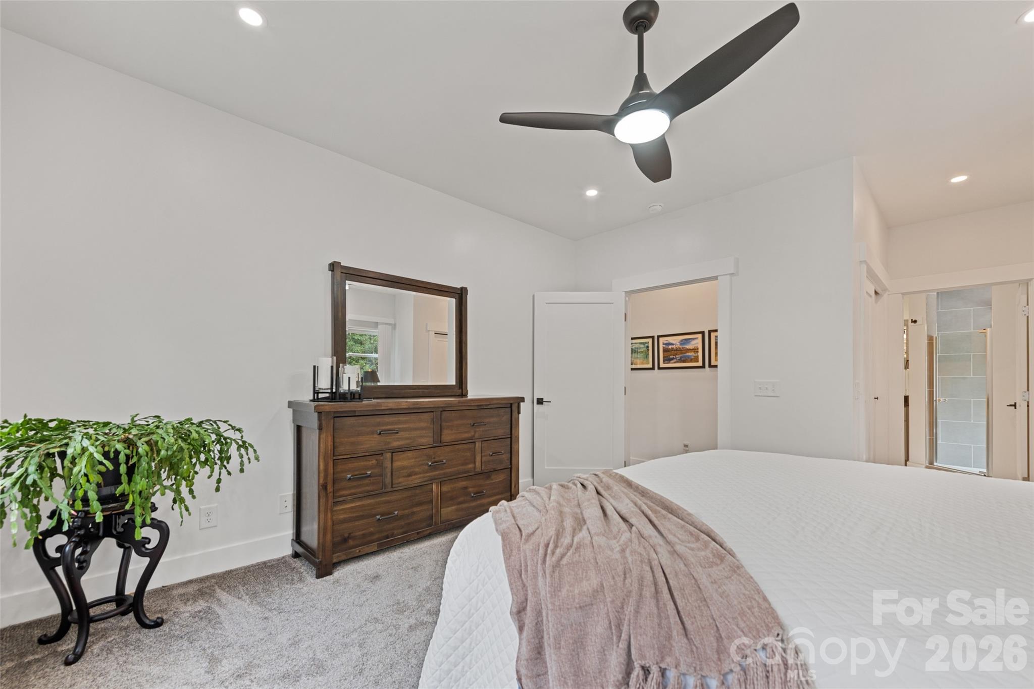 1185 Wallalieu Road Otto, NC 28763 - Photo 22 of 43 a bedroom with a bed and a dresser