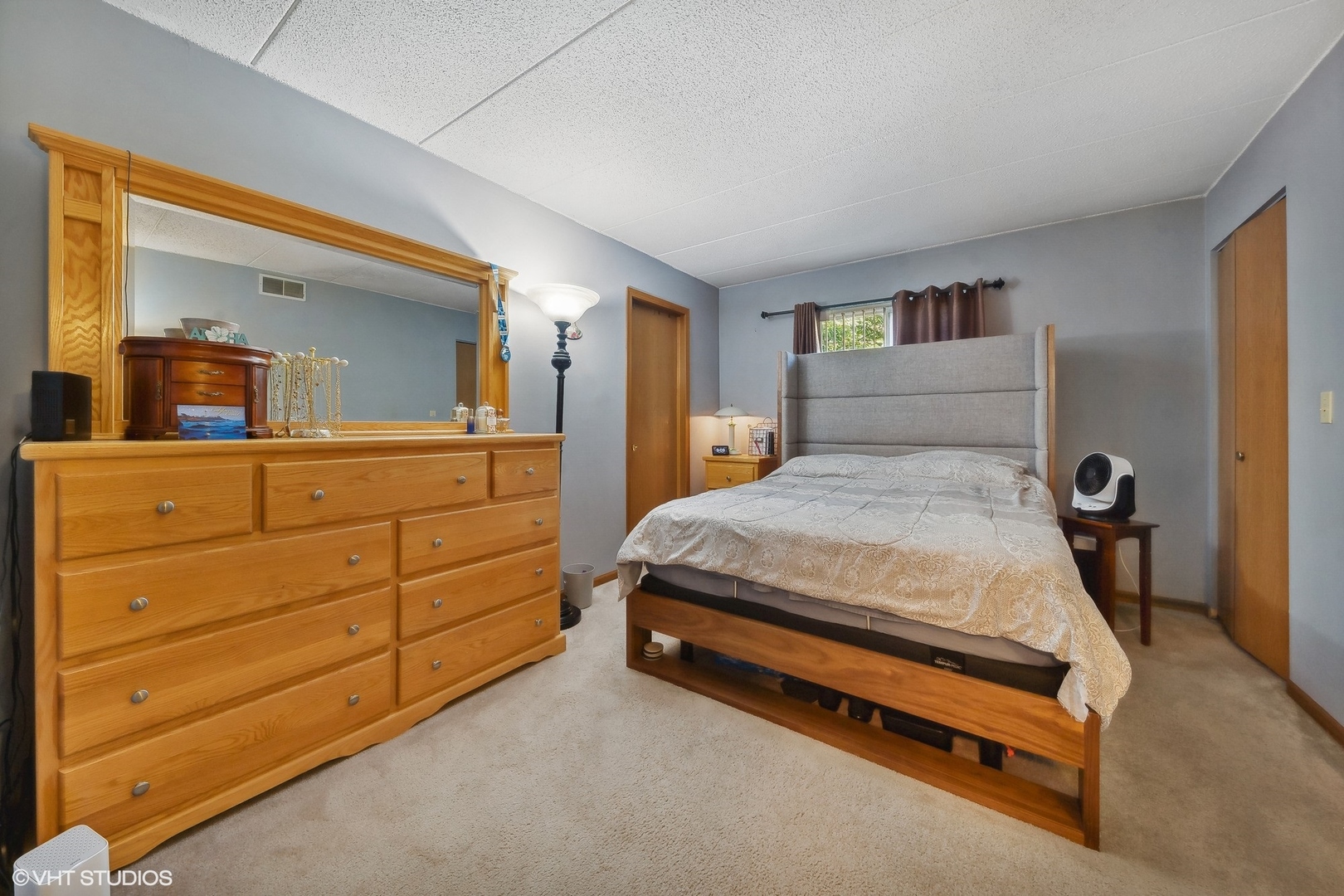 4232 West 77th Street, Unit 206 Chicago, IL 60652 - Photo 11 of 17 a bedroom with a bed and a dresser