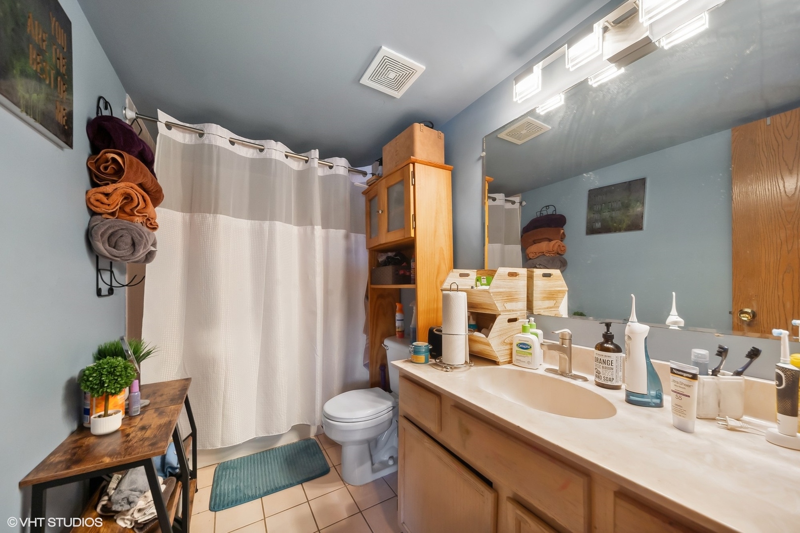 4232 West 77th Street, Unit 206 Chicago, IL 60652 - Photo 15 of 17 a bathroom with a sink mirror vanity and toilet