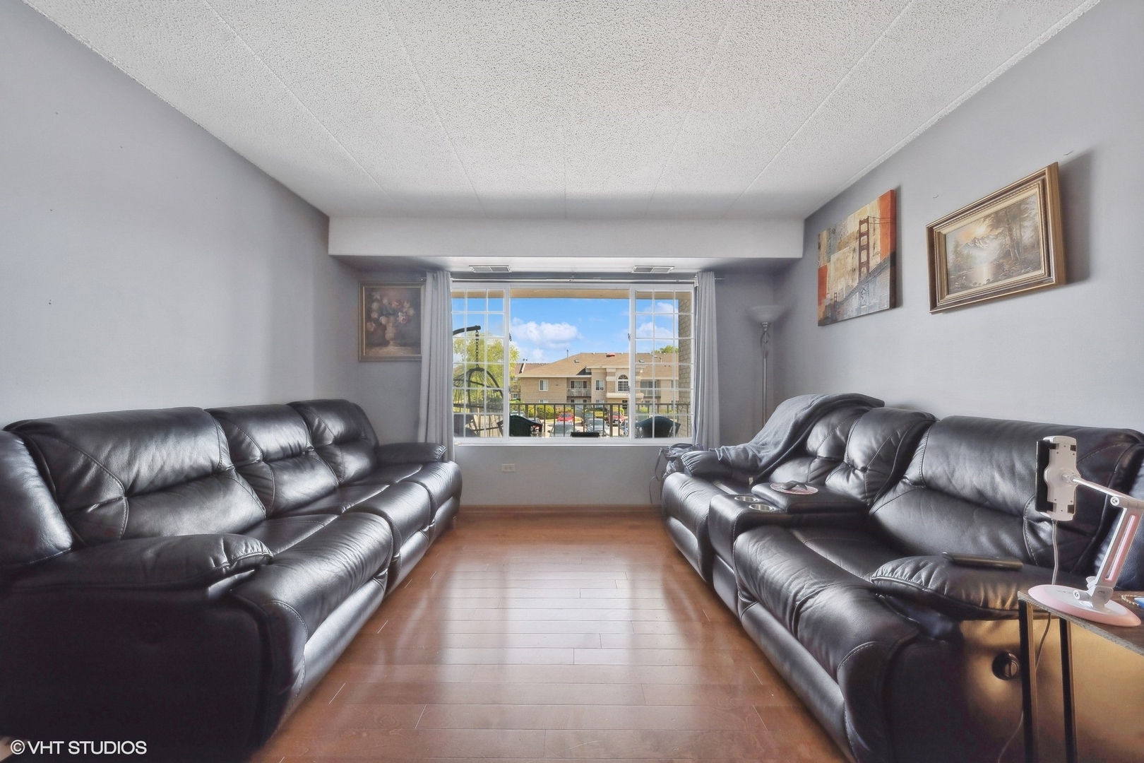 4232 West 77th Street, Unit 206 Chicago, IL 60652 - Photo 2 of 17 a living room with furniture and a large window