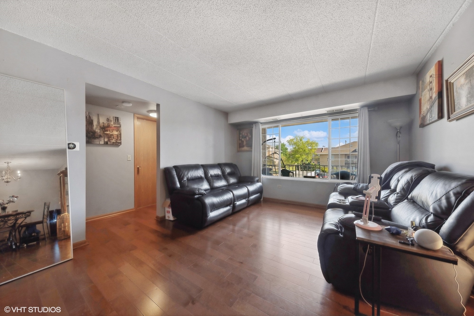 4232 West 77th Street, Unit 206 Chicago, IL 60652 - Photo 4 of 17 a living room with furniture and a large window