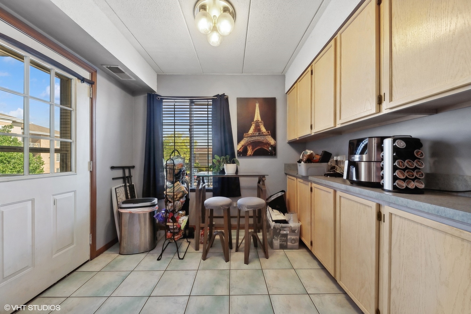 4232 West 77th Street, Unit 206 Chicago, IL 60652 - Photo 7 of 17 a kitchen with granite countertop furniture a sink a window and stainless steel appliances