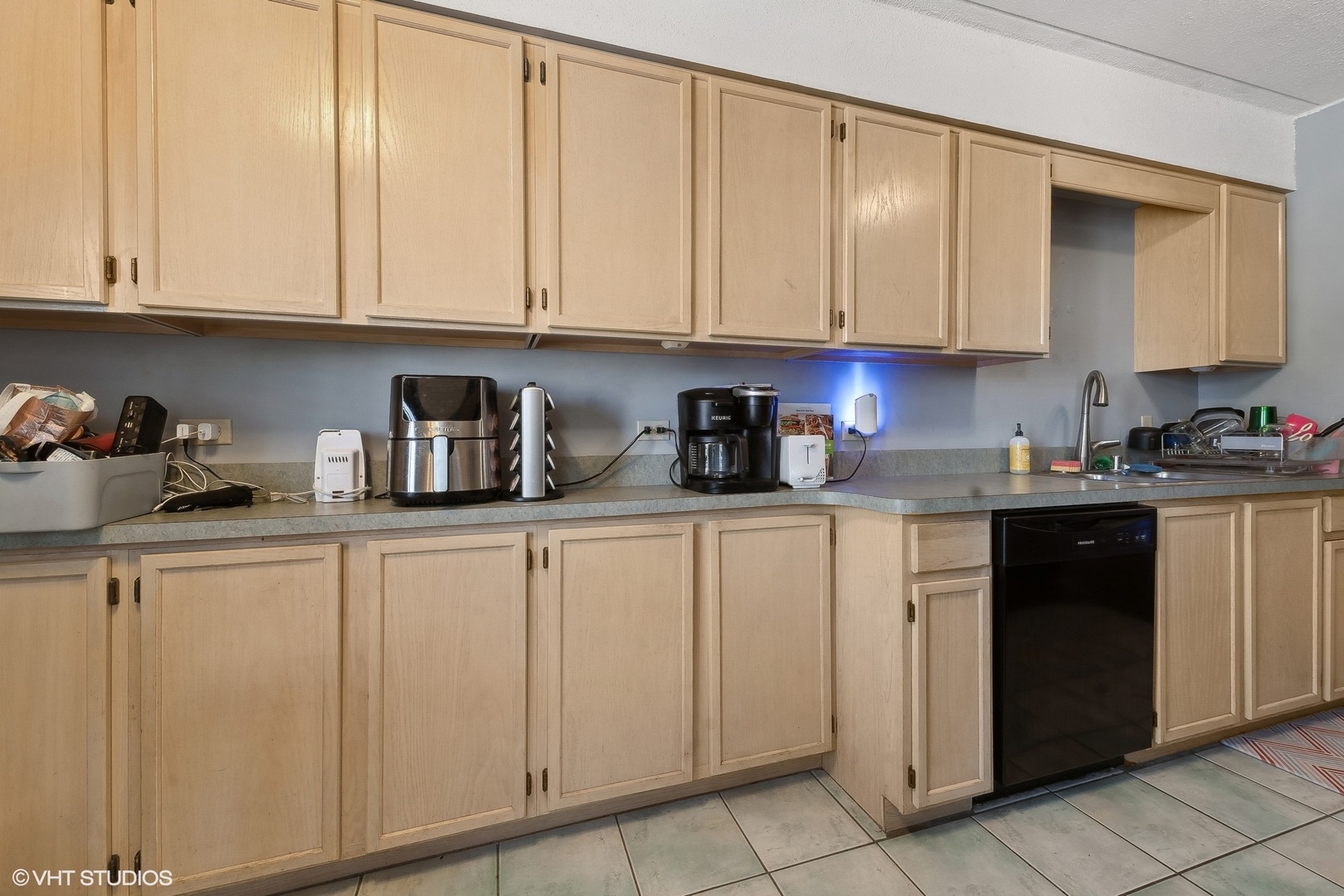 4232 West 77th Street, Unit 206 Chicago, IL 60652 - Photo 8 of 17 a kitchen with white cabinets and sink