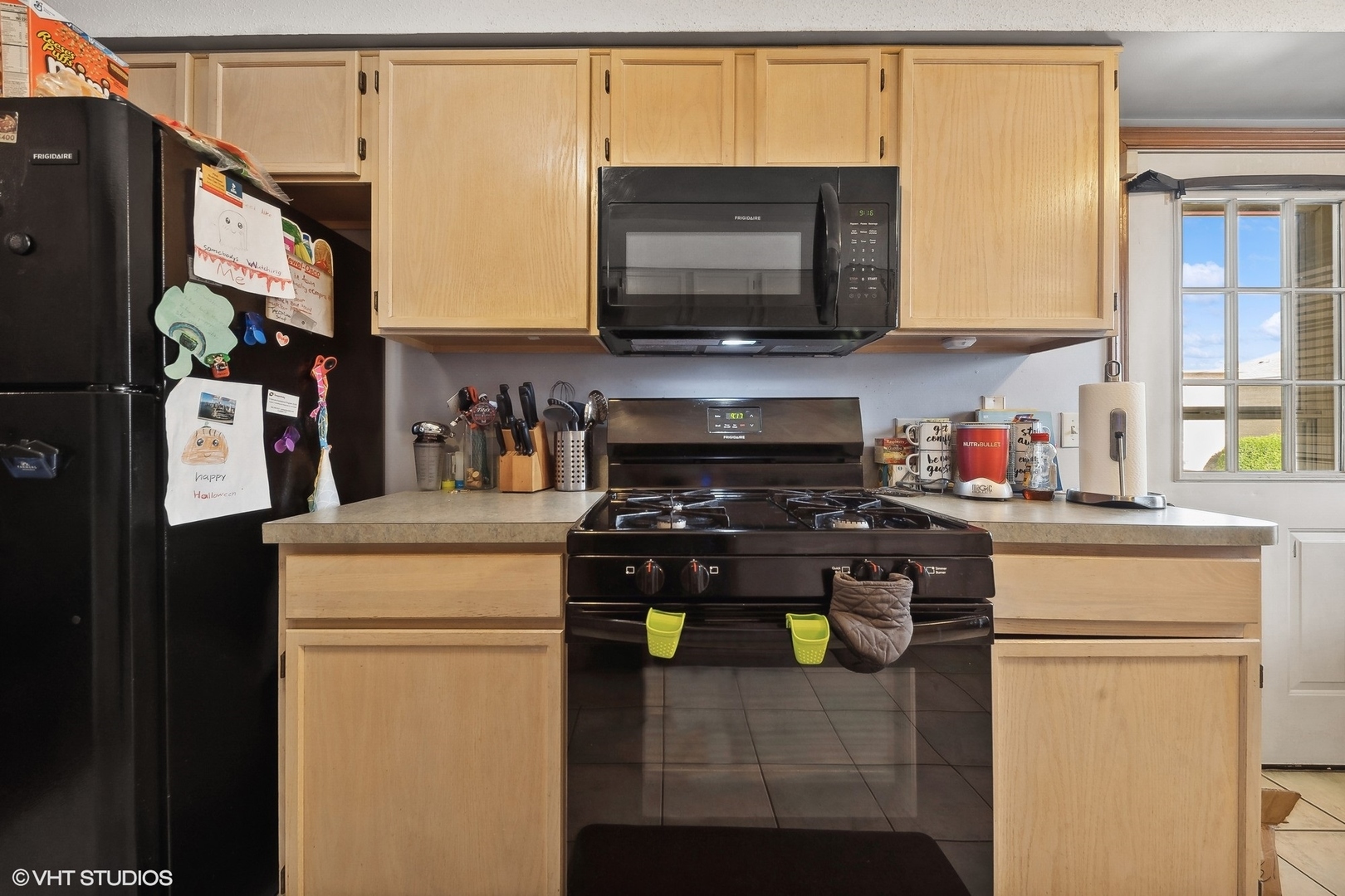 4232 West 77th Street, Unit 206 Chicago, IL 60652 - Photo 9 of 17 a kitchen with stainless steel appliances a stove refrigerator and microwave