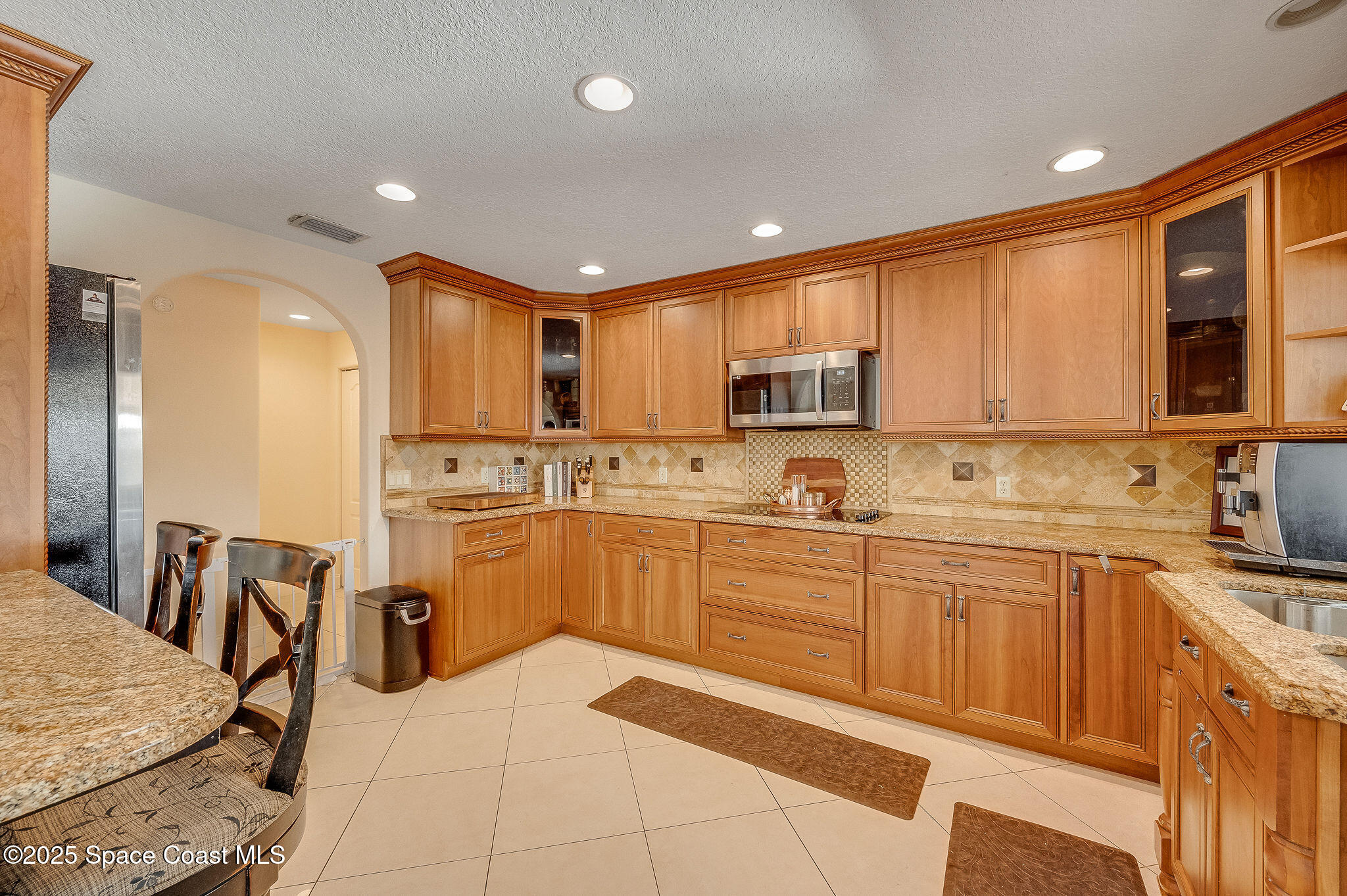1480 West Riviera Drive Merritt Island, FL 32952 - Photo 12 of 93 a kitchen with a sink appliances and cabinets