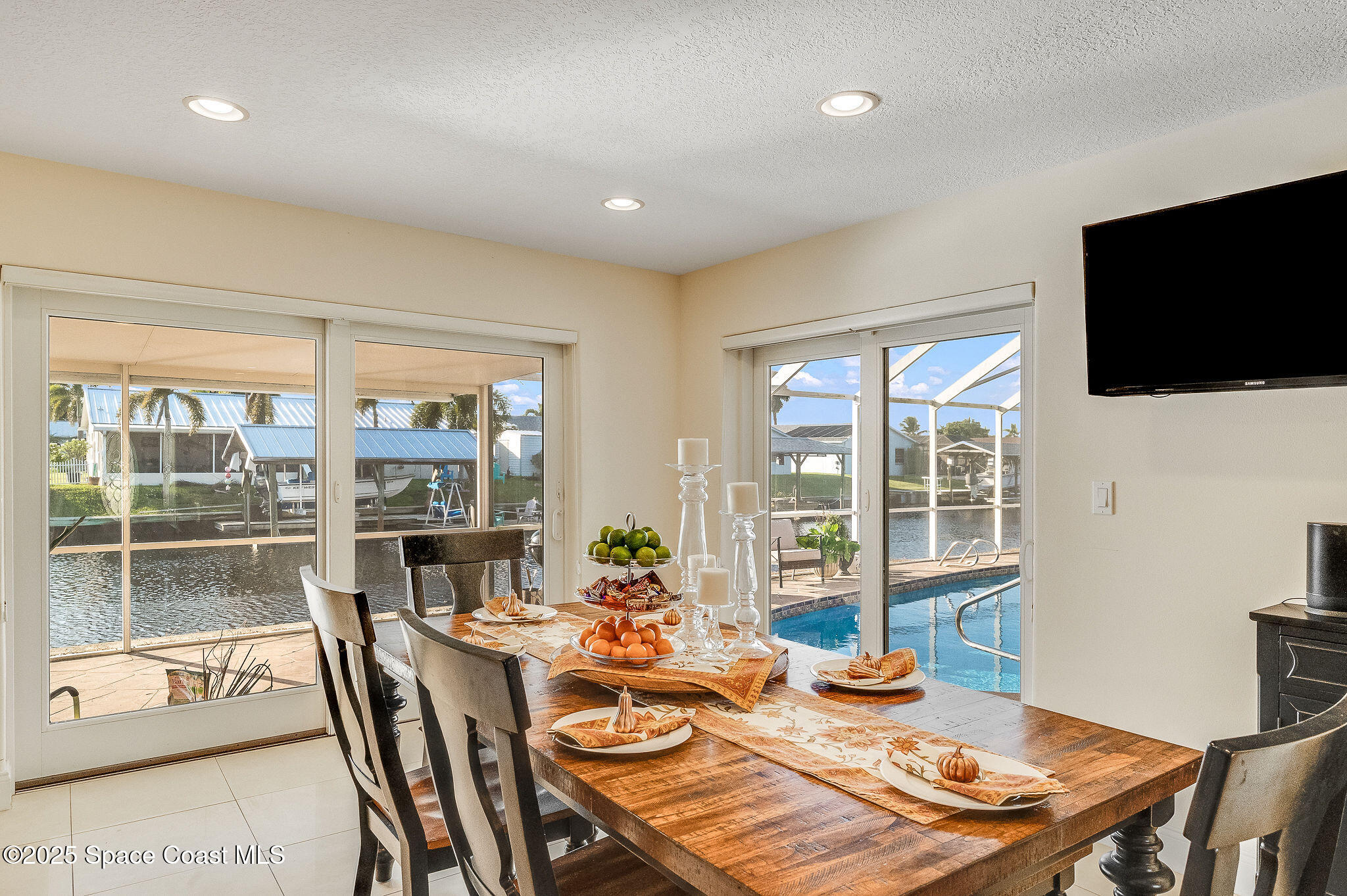 1480 West Riviera Drive Merritt Island, FL 32952 - Photo 16 of 93 a view of a dining room with furniture window and outside view