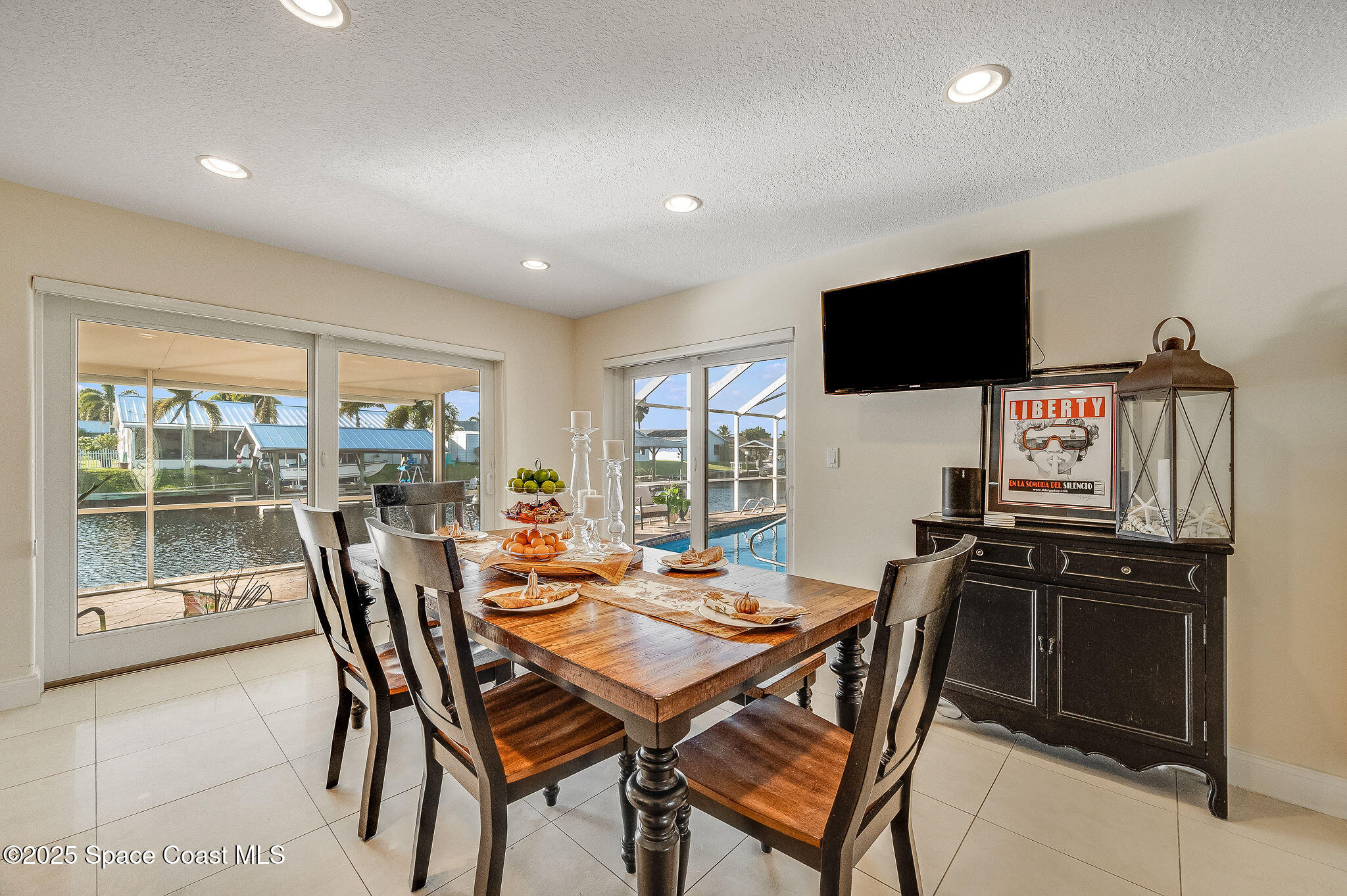 1480 West Riviera Drive Merritt Island, FL 32952 - Photo 17 of 93 a view of a dining room with furniture window and outside view