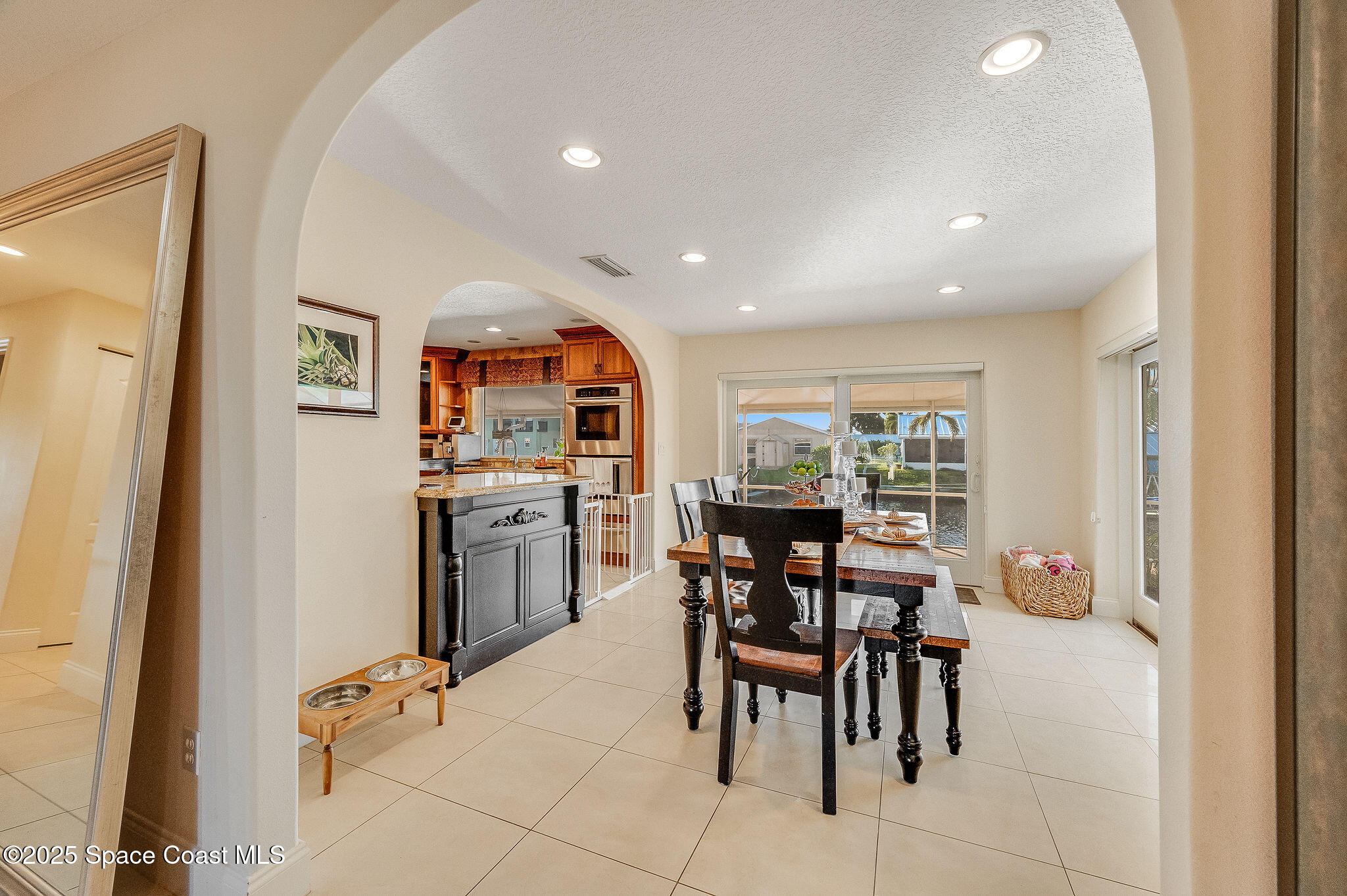 1480 West Riviera Drive Merritt Island, FL 32952 - Photo 22 of 93 a view of a dining room with furniture and a window