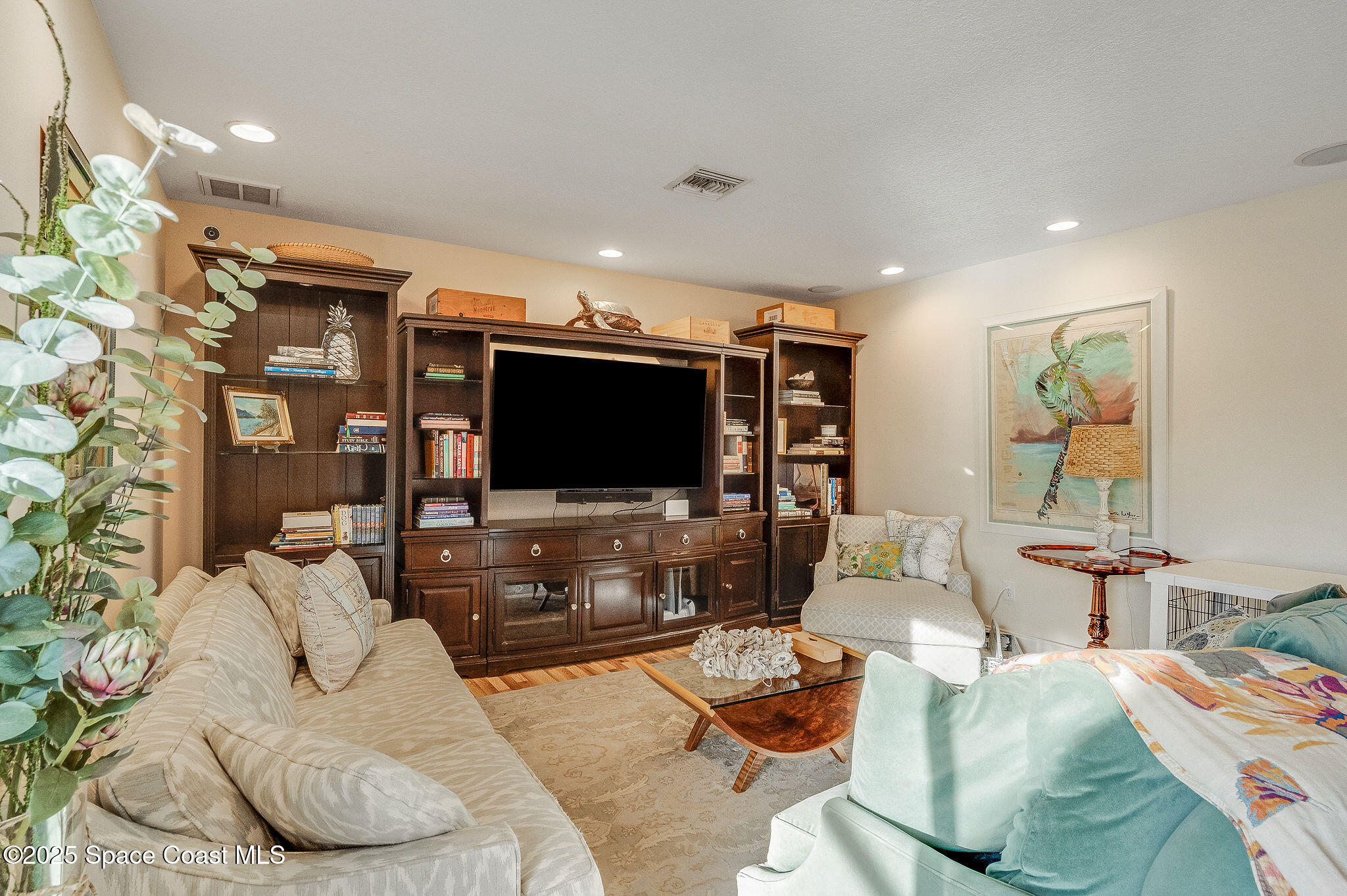 1480 West Riviera Drive Merritt Island, FL 32952 - Photo 26 of 93 a living room with furniture and a flat screen tv