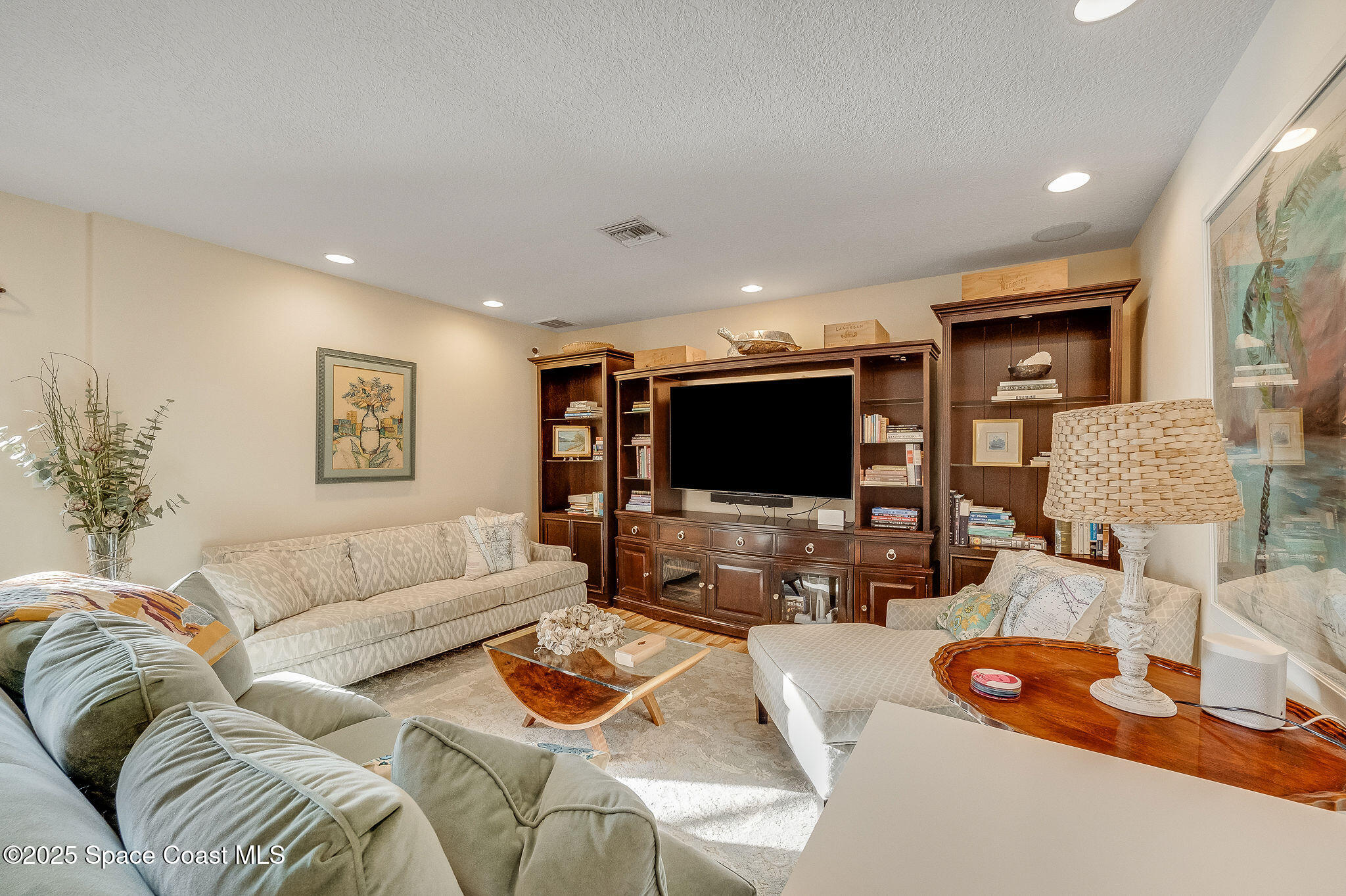 1480 West Riviera Drive Merritt Island, FL 32952 - Photo 27 of 93 a living room with furniture and a flat screen tv