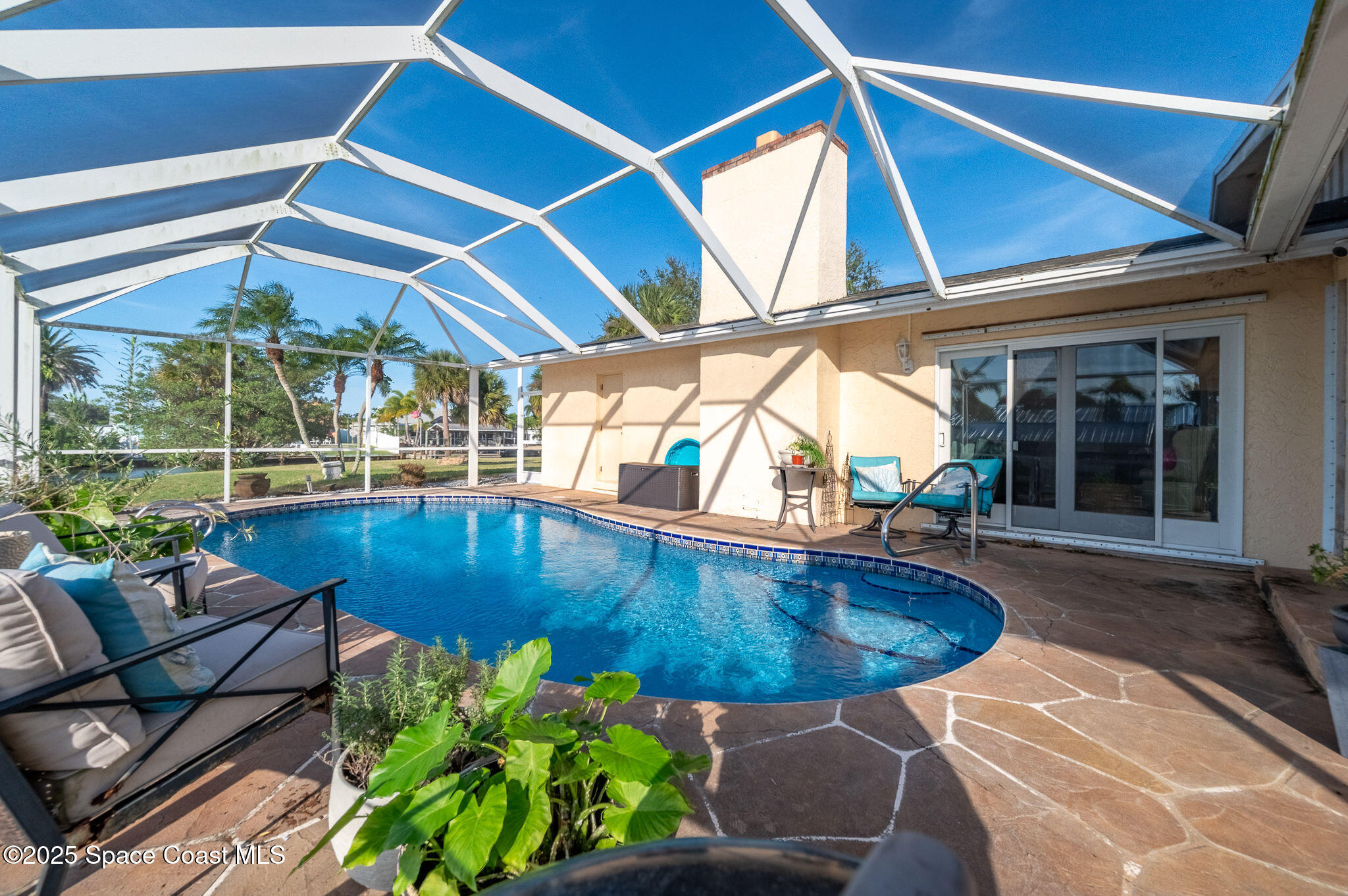 1480 West Riviera Drive Merritt Island, FL 32952 - Photo 52 of 93 a view of a patio with swimming pool