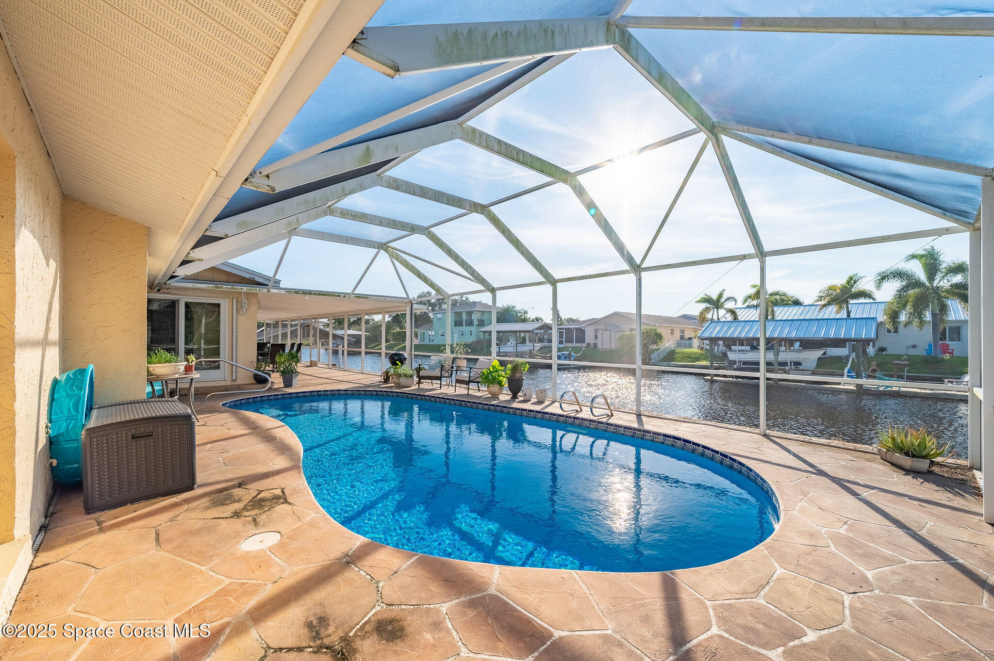1480 West Riviera Drive Merritt Island, FL 32952 - Photo 55 of 93 a view of a swimming pool with seating area