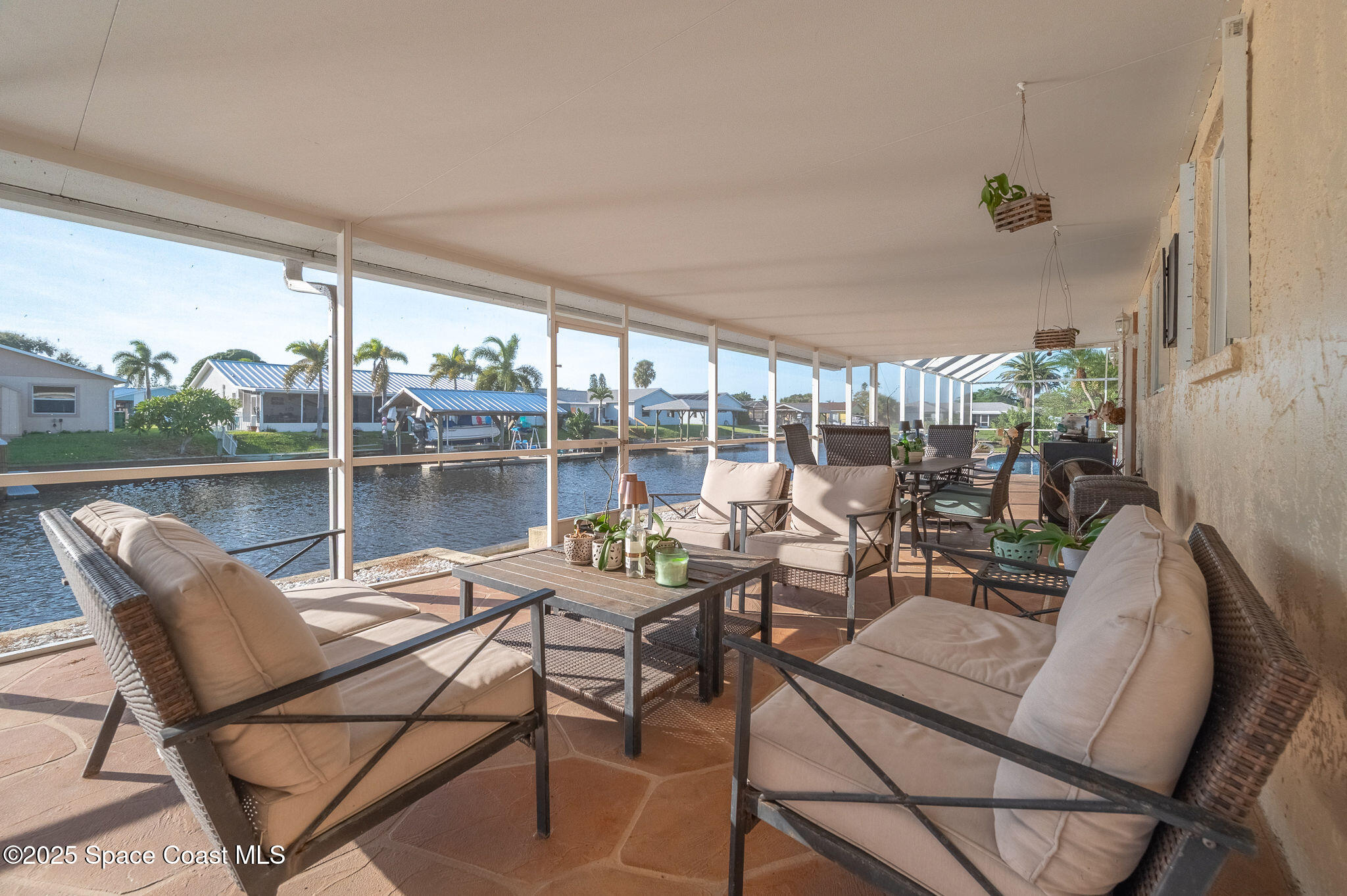 1480 West Riviera Drive Merritt Island, FL 32952 - Photo 58 of 93 a view of a patio with chairs and a table