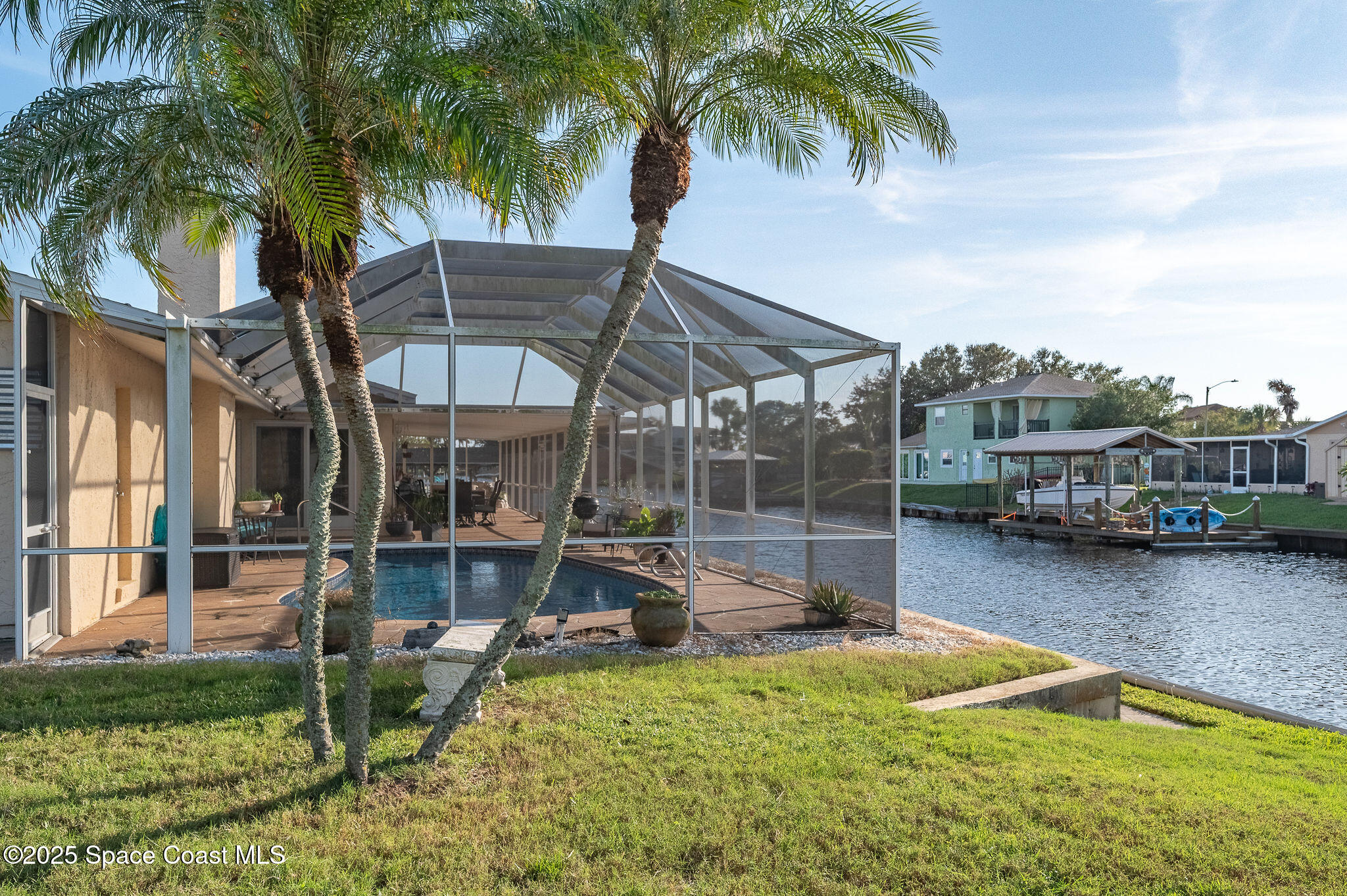 1480 West Riviera Drive Merritt Island, FL 32952 - Photo 64 of 93 a view of a house with pool and sitting area