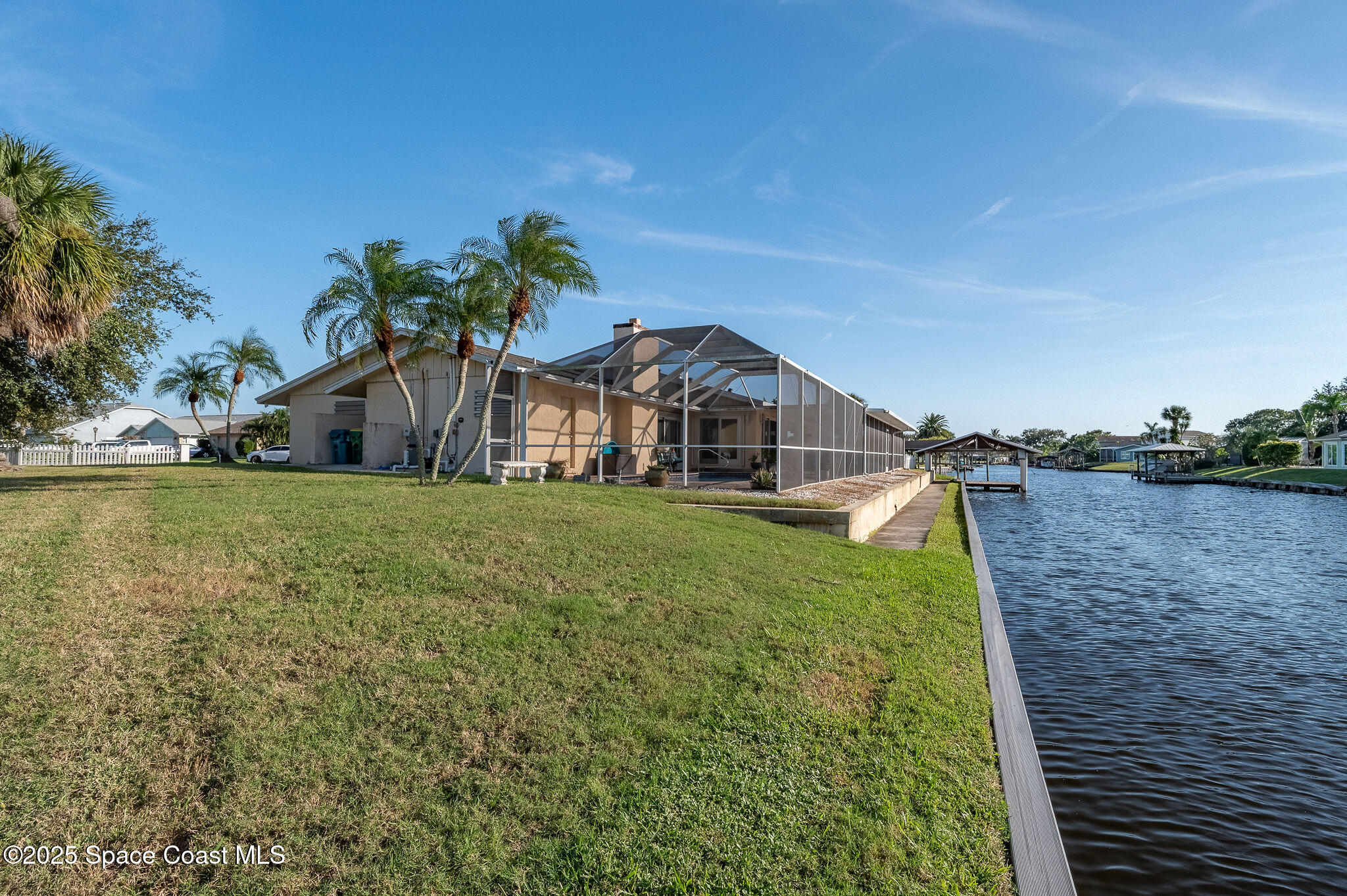 1480 West Riviera Drive Merritt Island, FL 32952 - Photo 65 of 93 a front view of a house with garden