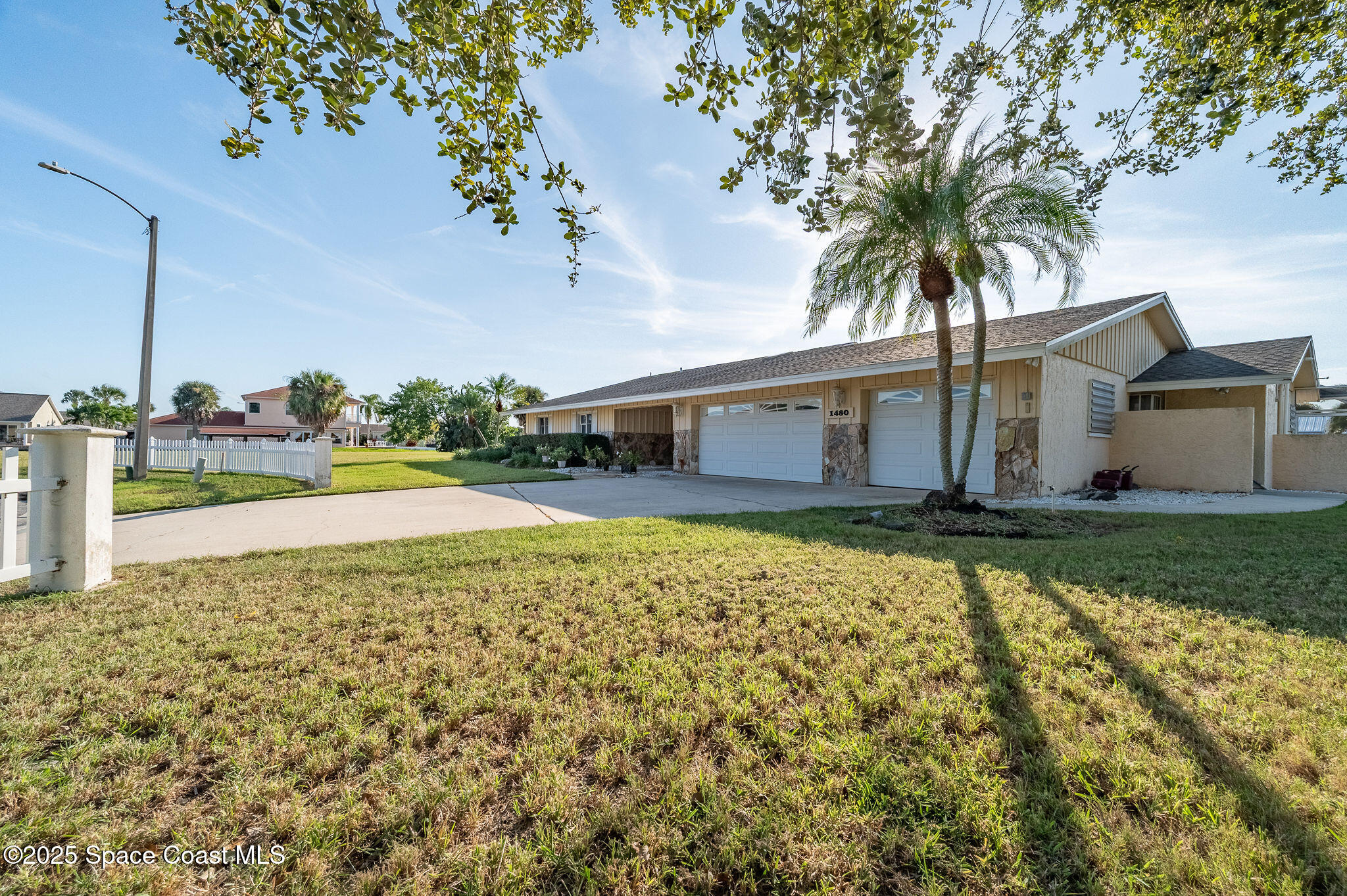 1480 West Riviera Drive Merritt Island, FL 32952 - Photo 72 of 93 a view of a house with a swimming pool