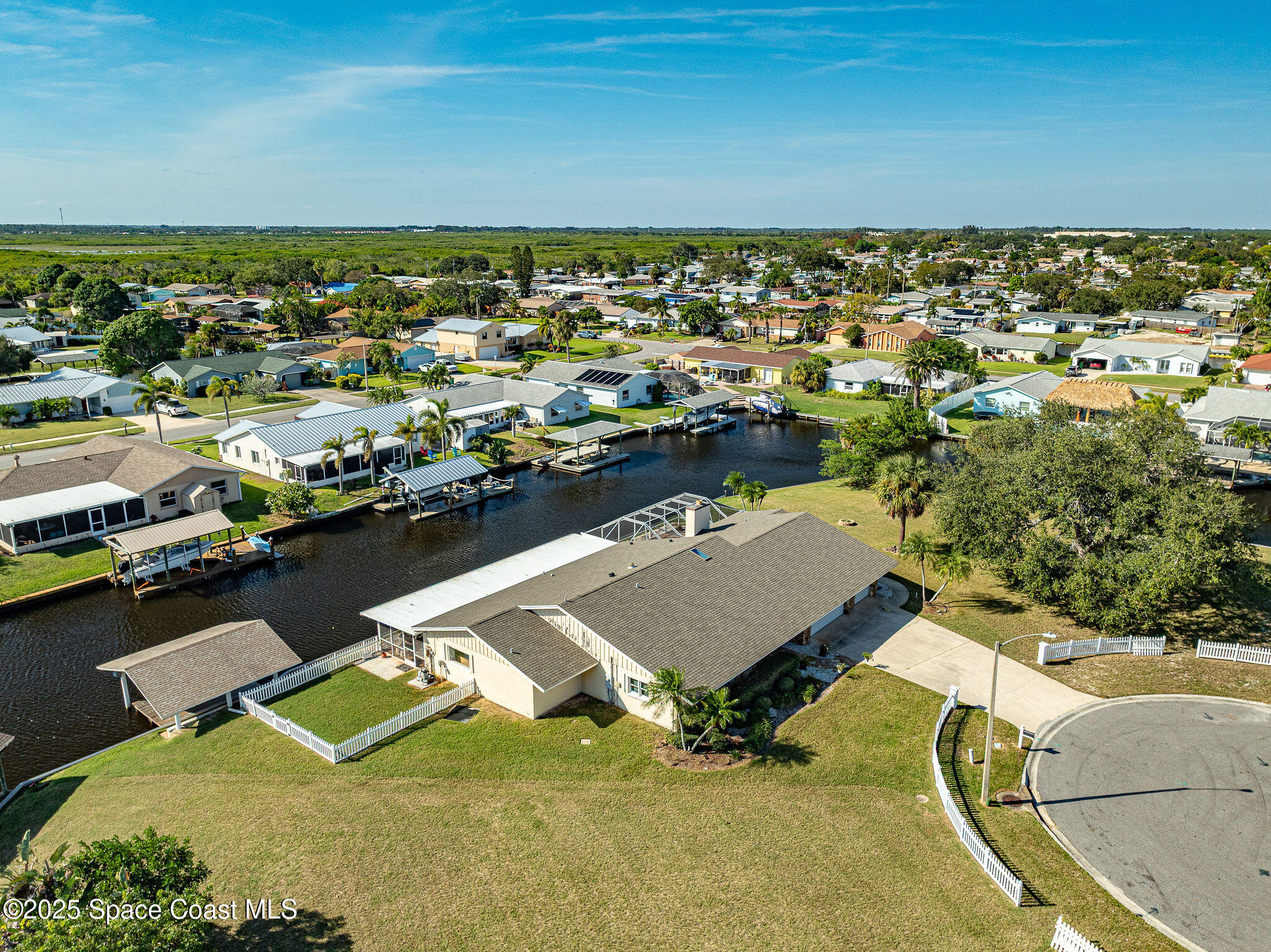 1480 West Riviera Drive Merritt Island, FL 32952 - Photo 82 of 93 an aerial view of a house with a swimming pool