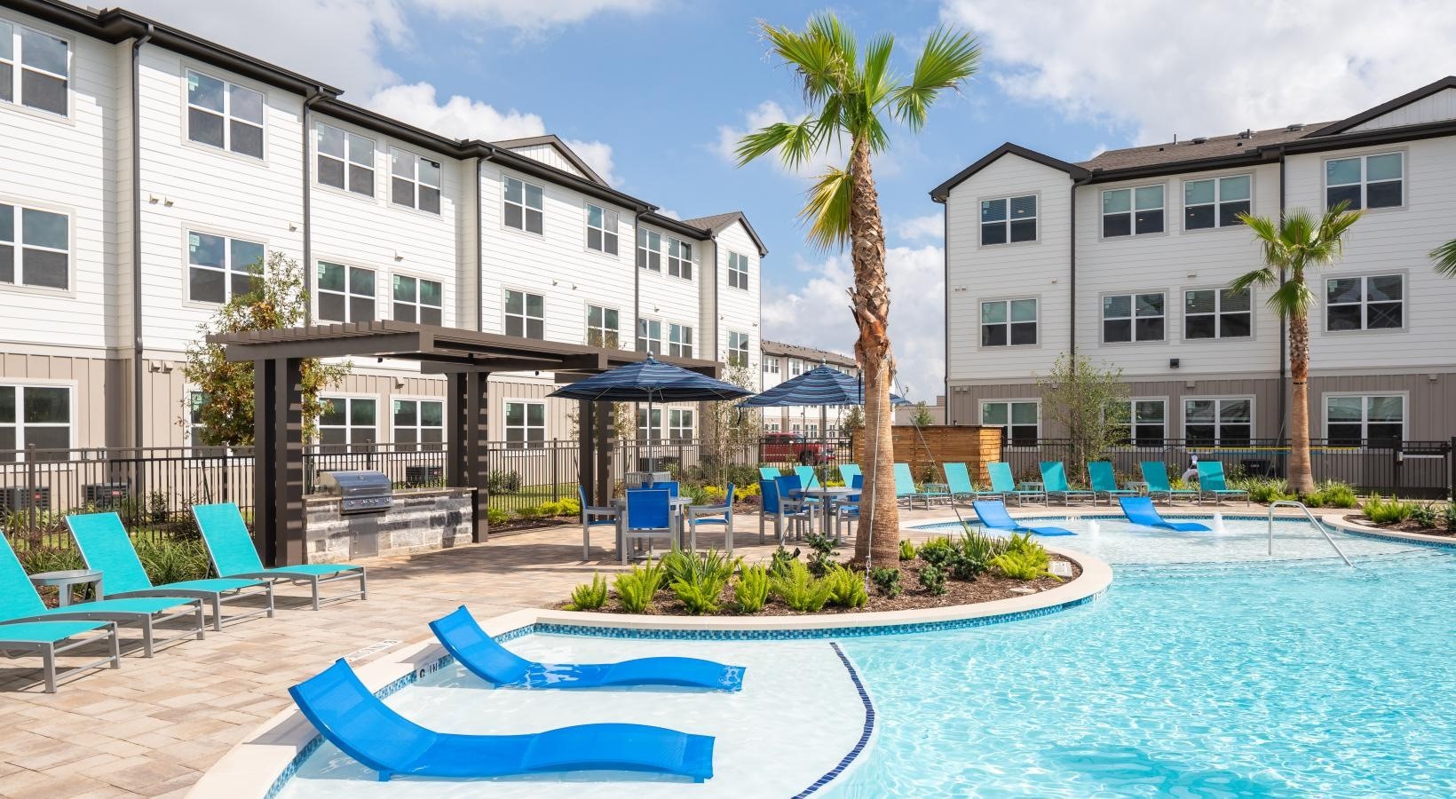 19770 Clay Road, Unit 1212201 Katy, TX 77449 - Photo 20 of 35 a front view of a building with outdoor seating