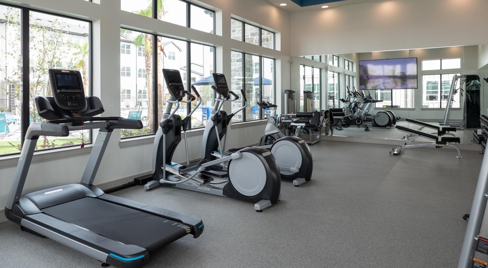 19770 Clay Road, Unit 1212201 Katy, TX 77449 - Photo 33 of 35 a room with gym equipment and windows