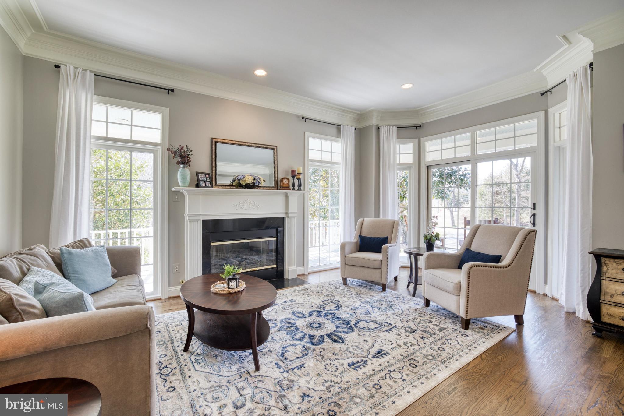 11110 Stuart Mill Road Oakton, VA 22124 - Photo 18 of 71 Living room with gas fireplace. Bow window w/doors