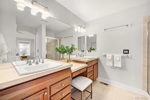 a bathroom with a sink double vanity and a mirror