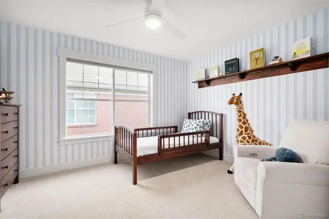 a view of a bedroom with furniture and windows