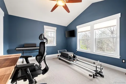 a room with gym equipment and a window
