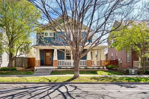 a front view of a house with a yard table and chairs