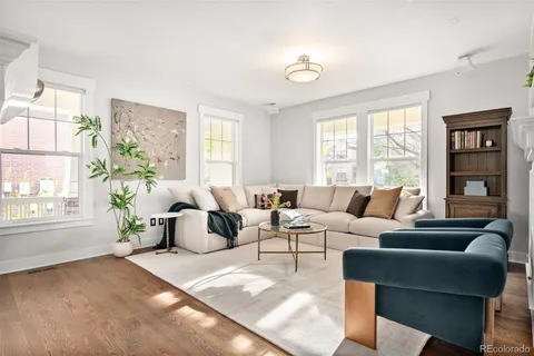 a living room with furniture and large window